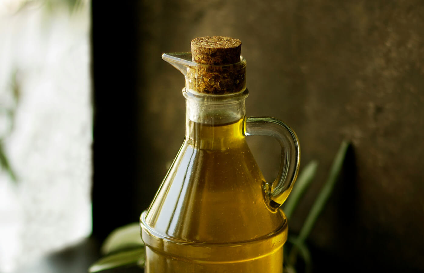 a bottle of olive oil containing good fats
