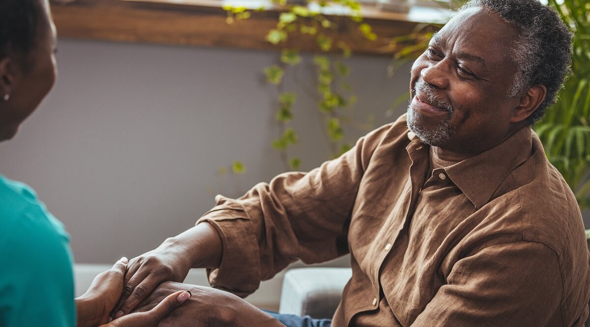 Man smiling after medical care