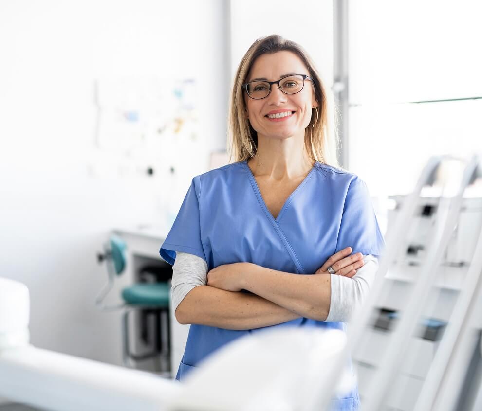 Provider posing in her examination room